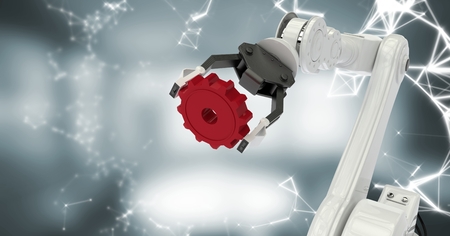 Digital composite of White robot claw with red cog and white interface against blurry grey roomの写真素材