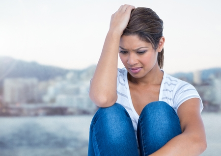 Digital composite of Stressed woman by city portの写真素材
