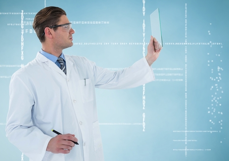 Digital composite of Man in lab coat and goggles with pen holding up glass device against white...