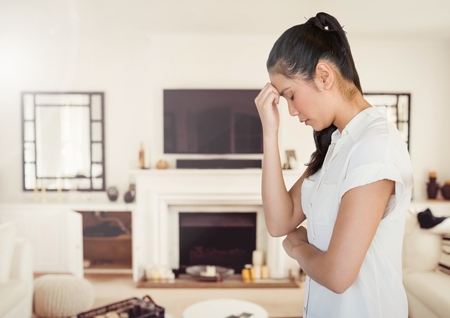 Digital composite of Stressed woman at homeの写真素材