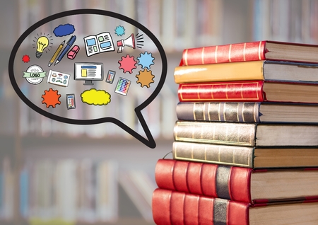 Digital composite of Pile of books with speech bubble and graphics against blurry bookshelfの写真素材