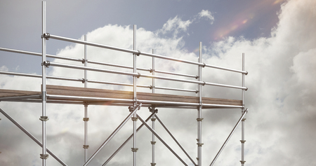 3d image of gray metal structure with shadow against blue sky with clouds