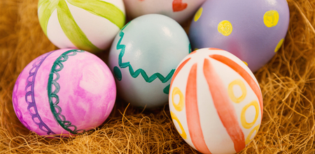 Close-up of painted Easter eggs in nestの写真素材
