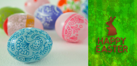 happy easter graphic against green paint splashed surface