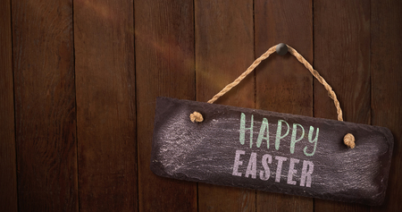 Easter greeting against wood panellingの写真素材