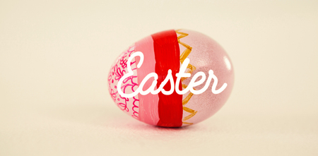 Easter greeting against painted easter eggs on white backgroundの写真素材