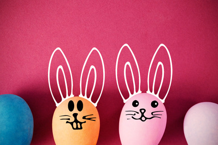 PE047_butterfly_02_bs_nf against easter eggs arranged on pink background