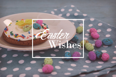 Easter greeting against cookie served with chocolates in a trayの写真素材