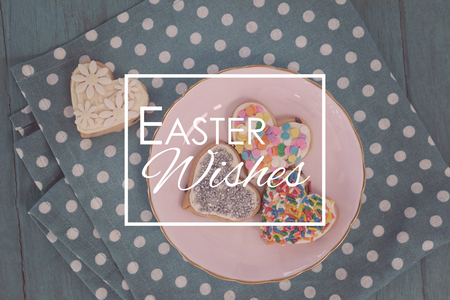 Easter greeting against various gingerbread cookies served in plate
