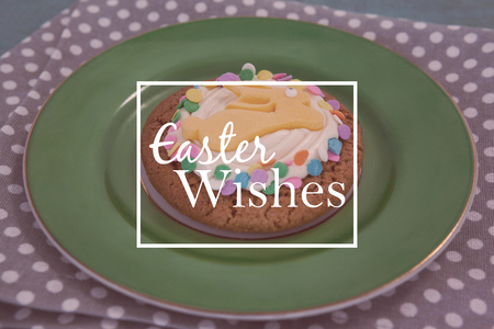 Easter greeting against chocolate cookie served in a plate