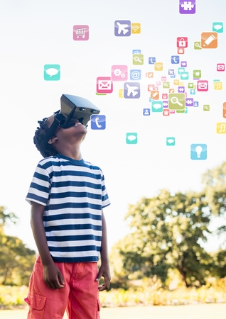 Digital composite of Boy wearing VR Virtual Reality Headset with Interfaceの写真素材