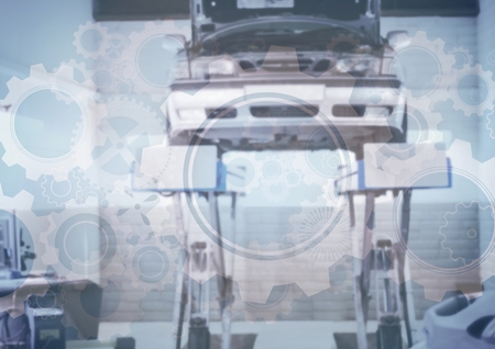 Digital composite of Car on stand with gear graphic overlayの写真素材