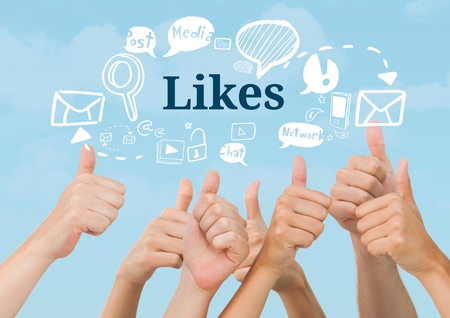 Digital composite of Many hands thumbs up with Likes text with drawings graphicsの写真素材