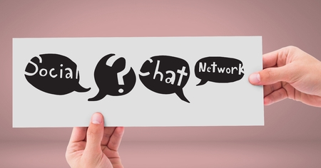 Digital composite of Hands holding card with social media chat networking speech bubbles drawingsの写真素材