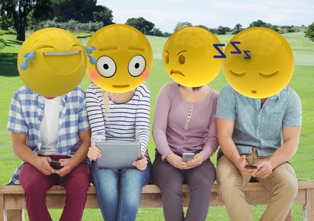 Digital composite of group of friends in the park. emoji face.の写真素材