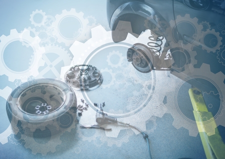 Digital composite of Car with wheel off and gear graphic overlay