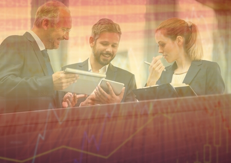Digital composite of Three business people at balcony with orange chart graphic overlayの写真素材