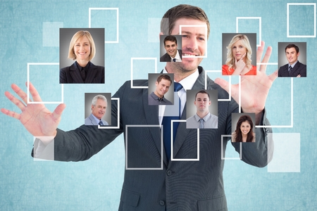 Digital composite of Happy businessman selecting candidatesの写真素材