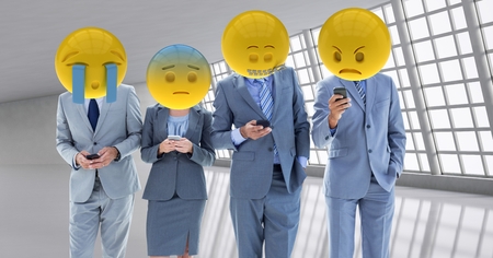 Digital composite of Business workers receiving a bad notice . Emoji heads.の写真素材