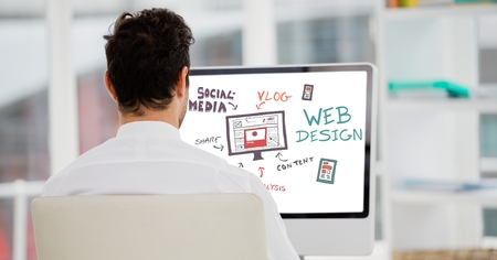 Digital composite of Rear view of businessman analyzing plan on computerの写真素材