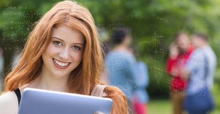 Digital composite of Digitally generated image of various equations with smiling college student in...