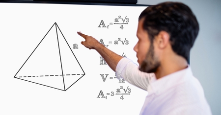 Digital composite of Man pointing over geometric shape by formulas on board