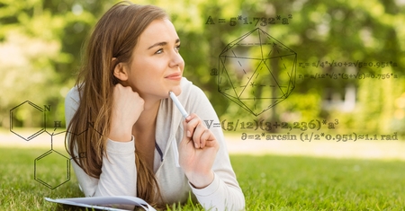 Digital composite of Digitally generated image of various structure with woman studying on field in...