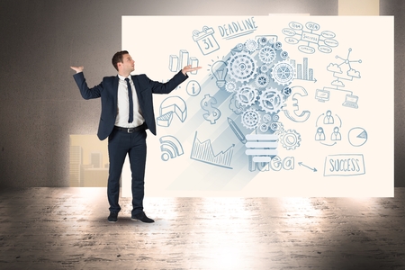 Digital composite of Businessman with arms raised standing against bill board with business iconsの写真素材