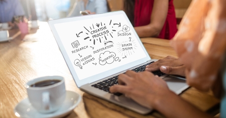 Digital composite of Cropped image of business woman making creative process diagram at tableの写真素材