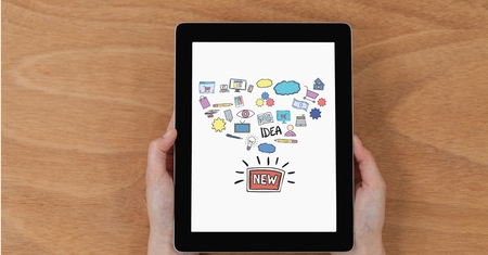 Digital composite of Hands holding digital tablet with new idea iconsの写真素材