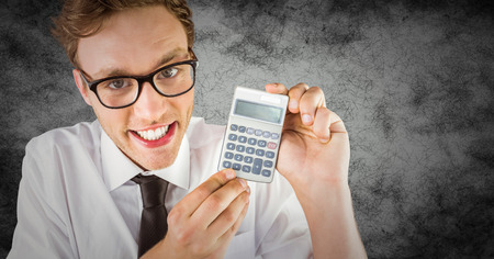 Digital composite of Nerd with calculator against grunge backgroundの写真素材