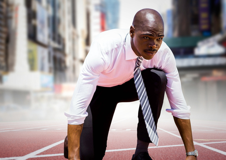 Digital composite of Business man at start line against blurry city
