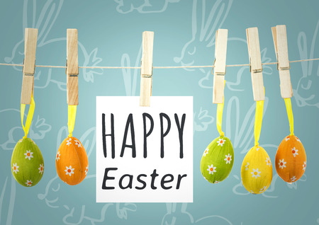 Digital composite of Grey type on note on washing line with eggs against blue easter pattern