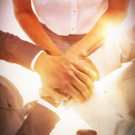 High angle view of business team stacking hands