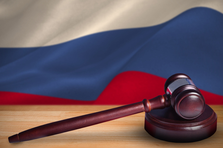 Hammer and gavel against 3d digitally generated russian national flagの写真素材