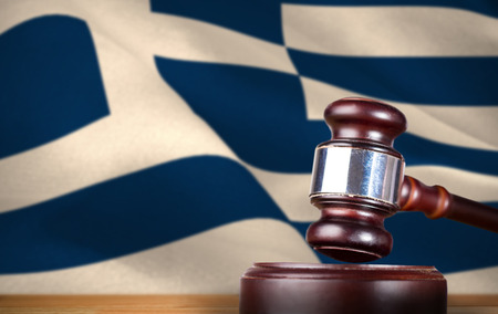 Hammer and gavel against 3d digitally generated greek national flagの写真素材