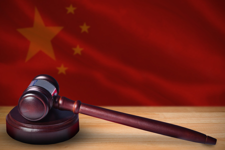 Hammer and gavel against 3d close-up of chinese flagの写真素材