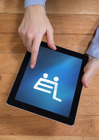 Digital composite of Person using Tablet with Shopping trolley iconの写真素材