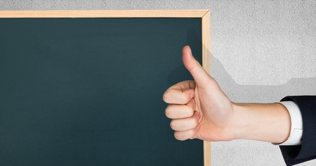 Digital composite of Thumb up green blackboardの写真素材