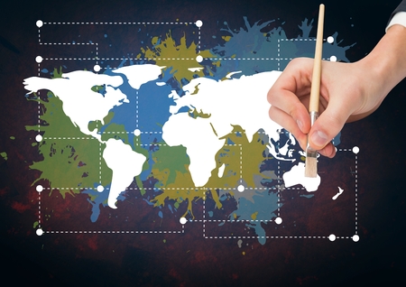 Digital composite of Hand painting a Colorful Map with paint splatters on wall backgroundの写真素材