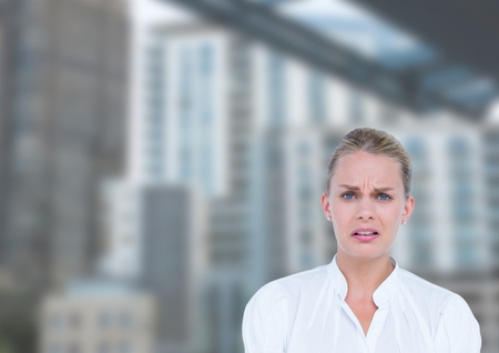 Digital composite of Business woman with look of disgust in the streteの写真素材