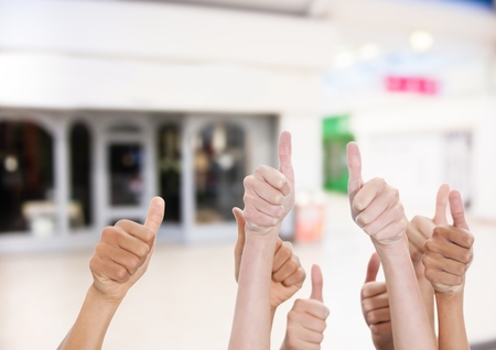 Digital composite of Thumbs up in the shopping center.の写真素材