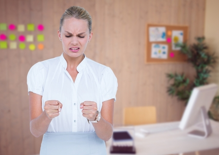 Digital composite of Angry business woman in her officeの写真素材