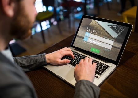 Digital composite of Men in a cafeteria with the laptop with login screenの写真素材