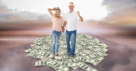 Digital composite of Couple holding hands while walking on moneyの写真素材