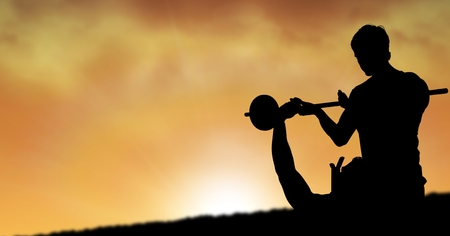 Digital composite of Silhouette of instructor assisting man in lifting barbells during sunsetの写真素材
