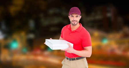 Digital composite of Confident delivery man holding pizza boxの写真素材