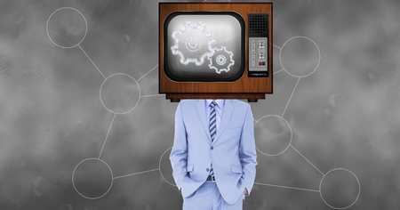 Digital composite of TV on businessman's head displaying gearsの写真素材