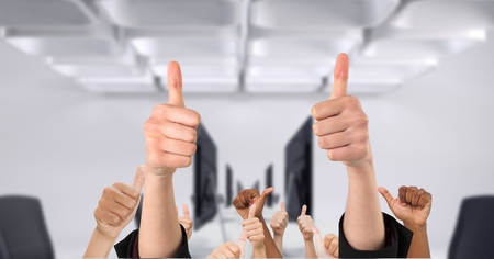 Digital composite of Business people's hands showing thumbs upの写真素材
