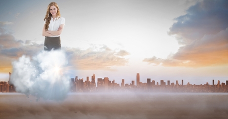 Digital composite of Digitally generated image of businesswoman on cloud against cityの写真素材